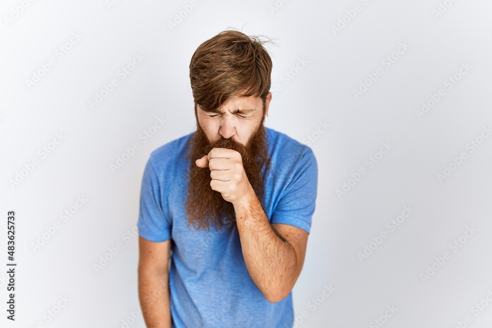 Caucasian man with long bear standing over isolated background feeling unwell and coughing as symptom for cold or bronchitis. health care concept. Caucasian man with long bear standing over isolated background feeling unwell and coughing as symptom for cold or bronchitis. health care concept.