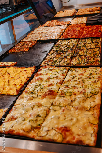 Pizza pieces. Yummy tasty pizza food with different flavors, meat and cheese. High quality photo