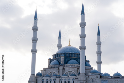 A mosque in Ottoman architecture. Minarets and dome of the mosque. Selective focus.