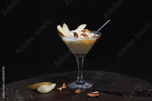 Cottage cheese with honey and nuts in a glass