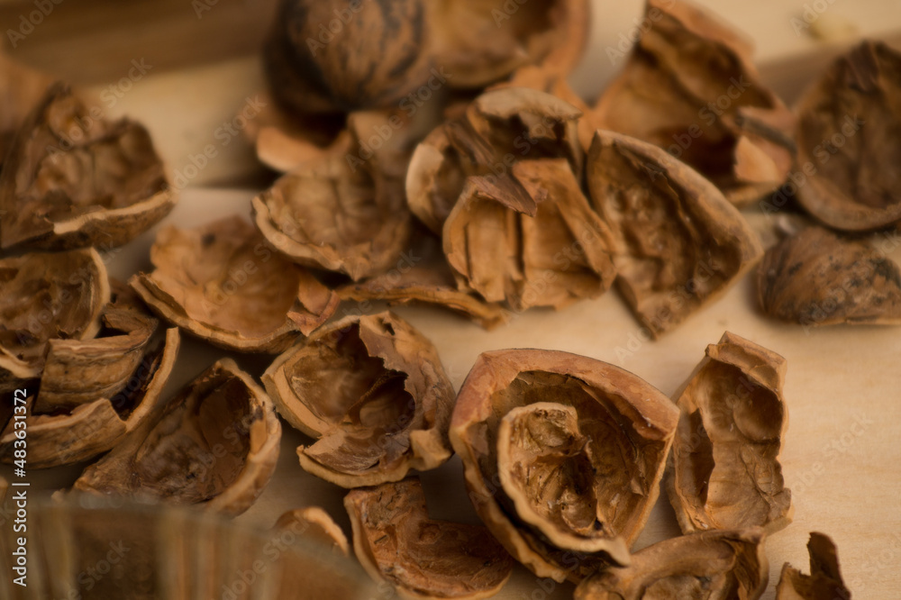 Peeled and shelled walnuts are scattered randomly on the table. Peeled and shelled walnuts are scattered randomly on the table.