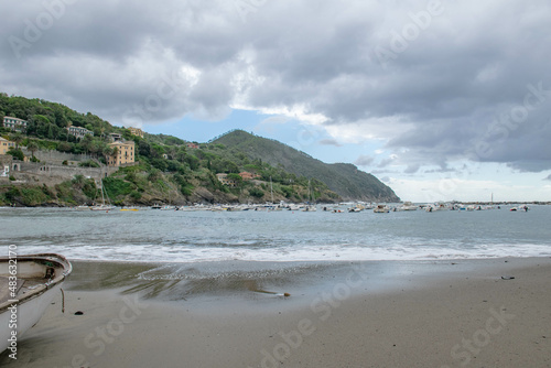 Cinque Terre  Sestri Levante  Italy  Liguria  September 2017. boat on a deserted beach  sea view  bay and cloudy sky