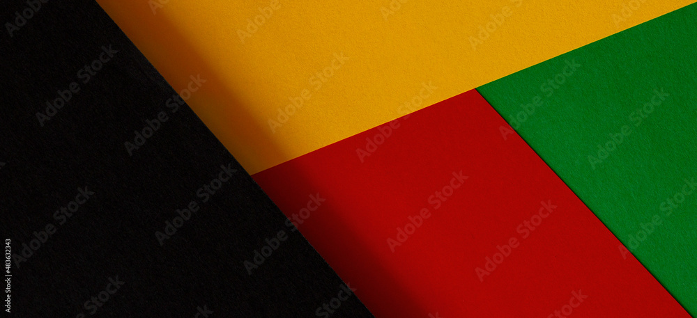 Abstract geometric black, red, yellow, green color paper background