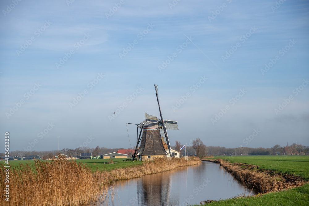 Naklejka premium dutch windmill in the country