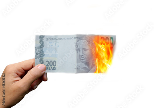 Canvastavla Flaming money in hand, isolated on white background