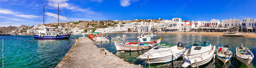 Mykonos island. Greece summer holidays. Panorama of old port in downtown. view with boats bars and restaurants. Cyclades.