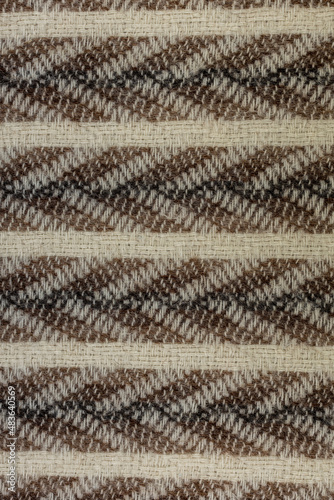 background or texture in the form of a woolen fabric with stripes and arrows