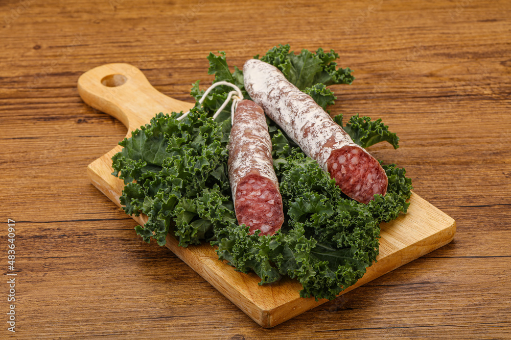 Spanish Fuet sausage with salad leaves