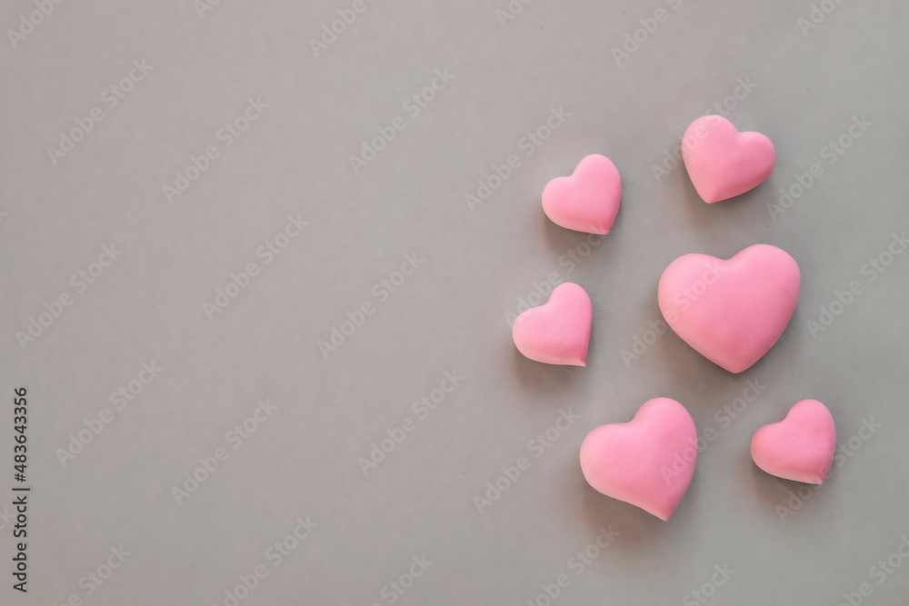 Obraz premium 3d pink hearts creative arrangement on neutral background. Concept of love, romantic relationship, heart shape symbol, simple layout, celebration of wedding, Valentine's Day border background.