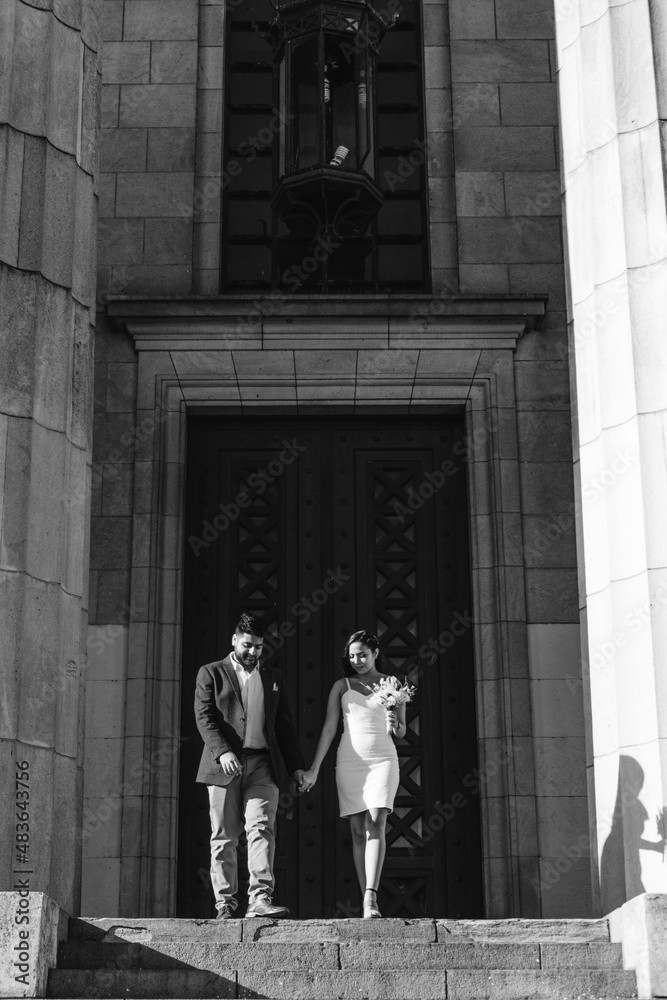 latin bride and groom walking down the stairs just married, black and white photo, artwork latin bride and groom walking down the stairs just married, black and white photo, artwork