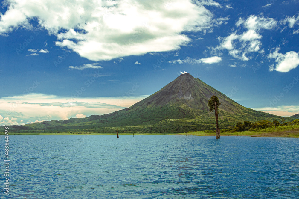 Arenal Volcano with a Arenal lake and blue sky of costa rica.