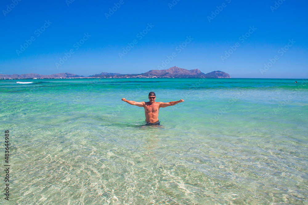 Obraz premium Beautiful view of man floating in Mediterranean sea islands Spain.