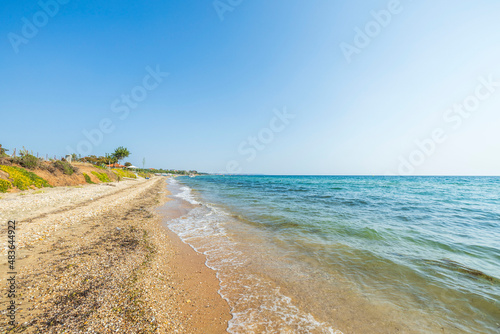 Beautiful view of beach in Mediterranean sea with turquoise water. Beautiful summer nature backgrounds. Greece.