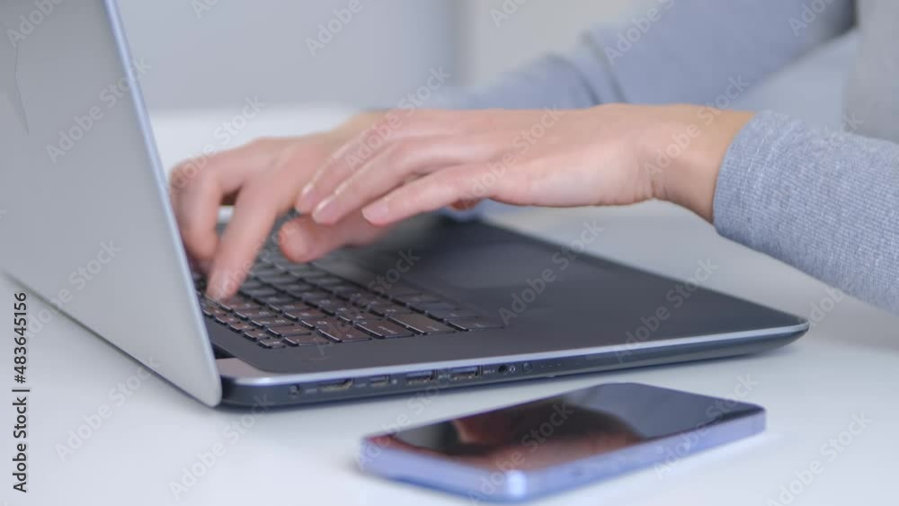 Business woman typing on laptop computer. Freelancer person doing distant work on notebook pc in 4k stock video. Young female working online during lockdown Business woman typing on laptop computer. Freelancer person doing distant work on notebook pc in 4k stock video. Young female working online during lockdown