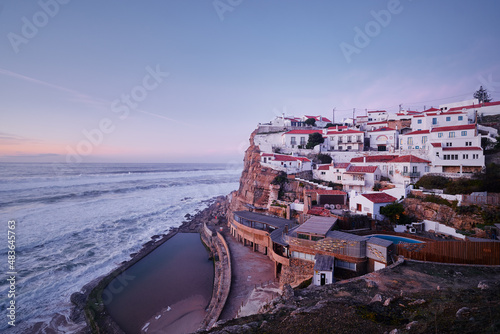 View of village and the natural pool of Azenhas do Mar, Colares (Sintra), Portugal. Ocean shore in sunset time. photo