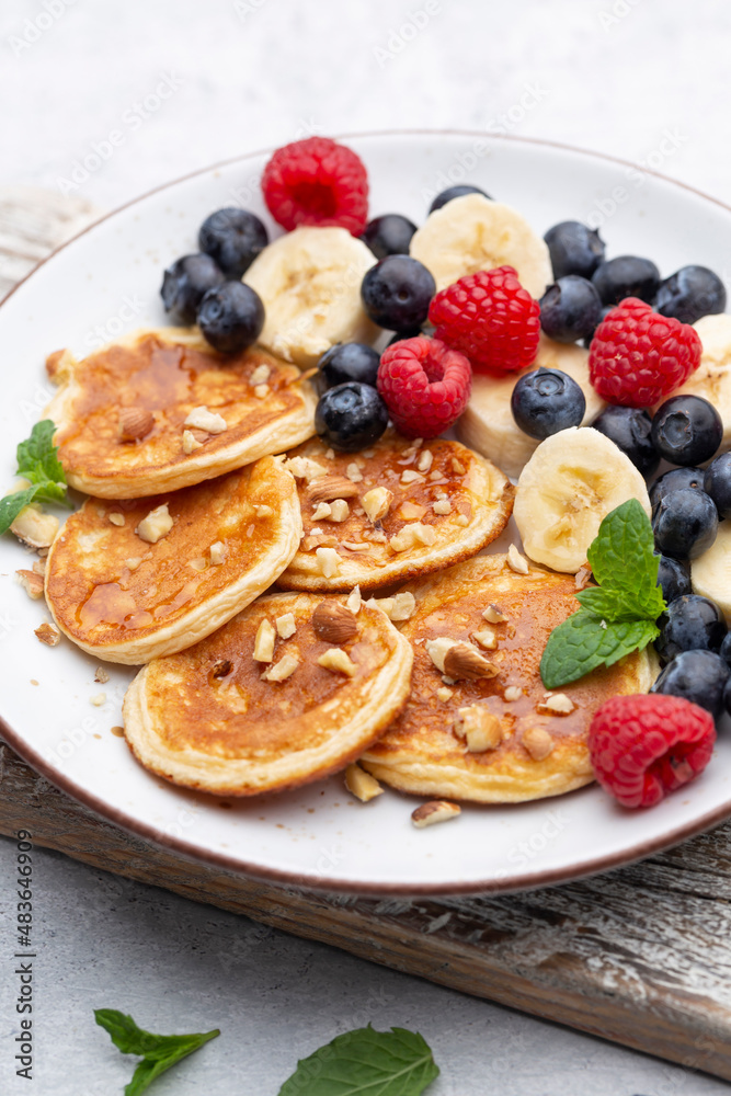 Keto pancakes made of diet flour or almond flour, served with berries. Keto pancakes made of diet flour or almond flour, served with berries.