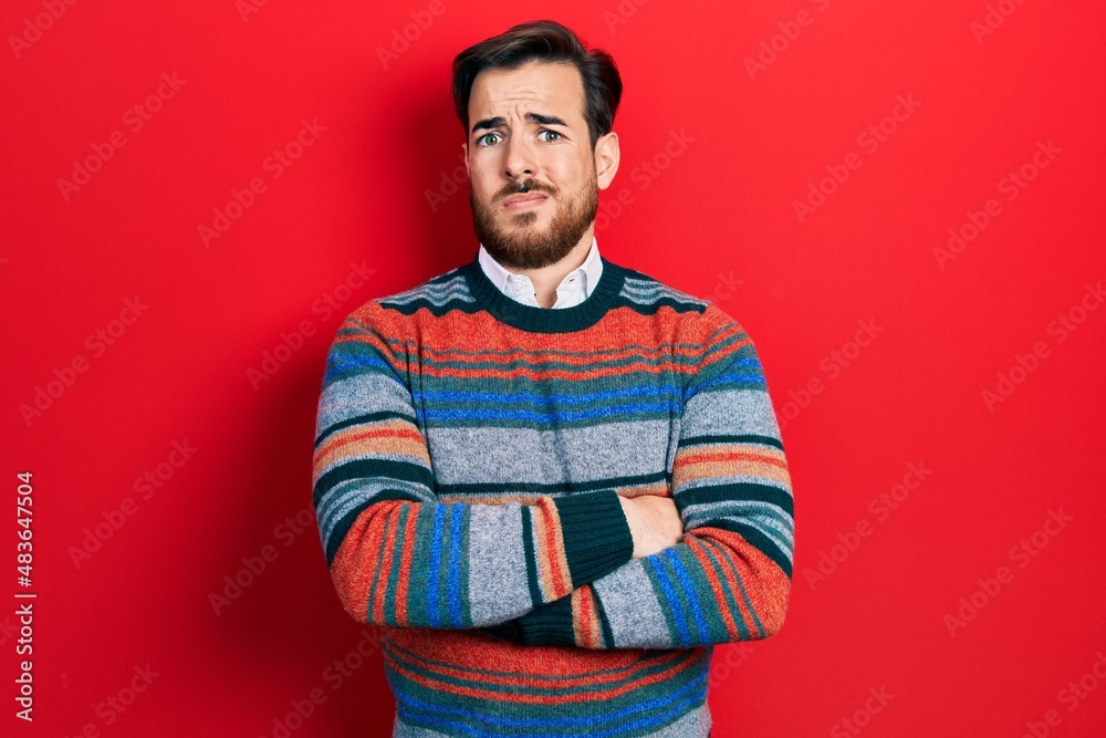 Handsome caucasian man with beard with arms crossed gesture clueless and confused expression. doubt concept. Handsome caucasian man with beard with arms crossed gesture clueless and confused expression. doubt concept.