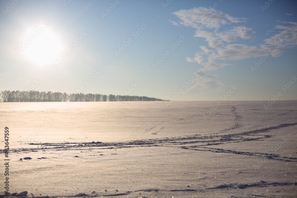 A field covered with snow in winter