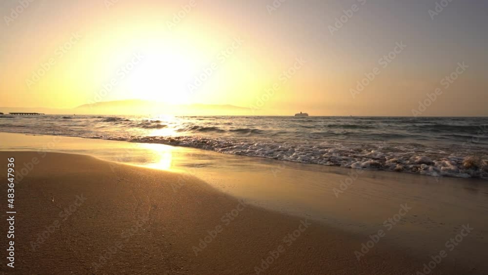 Beach waves during sunset in slow motion. Vlore, Albania Beach waves during sunset in slow motion. Vlore, Albania