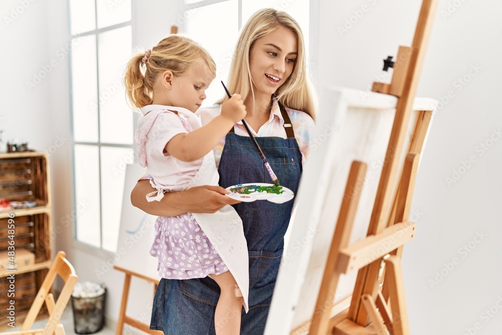 Mother and daughter smiling confident drawing at art studio Mother and daughter smiling confident drawing at art studio