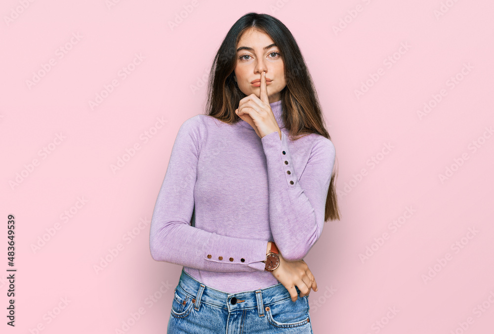 Young beautiful teen girl wearing turtleneck sweater asking to be quiet with finger on lips. silence and secret concept. Young beautiful teen girl wearing turtleneck sweater asking to be quiet with finger on lips. silence and secret concept.
