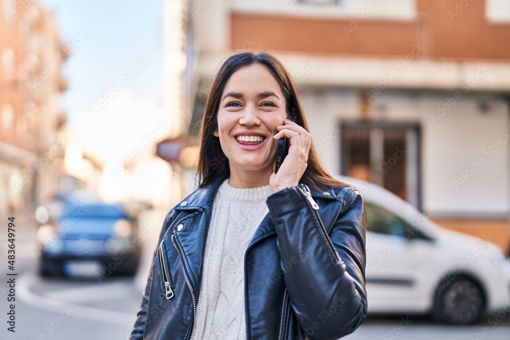 Young woman smiling confident talking on the smartphone at street Young woman smiling confident talking on the smartphone at street