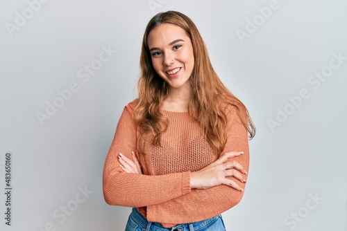 Young blonde woman wearing casual clothes happy face smiling with crossed arms looking at the camera. positive person.