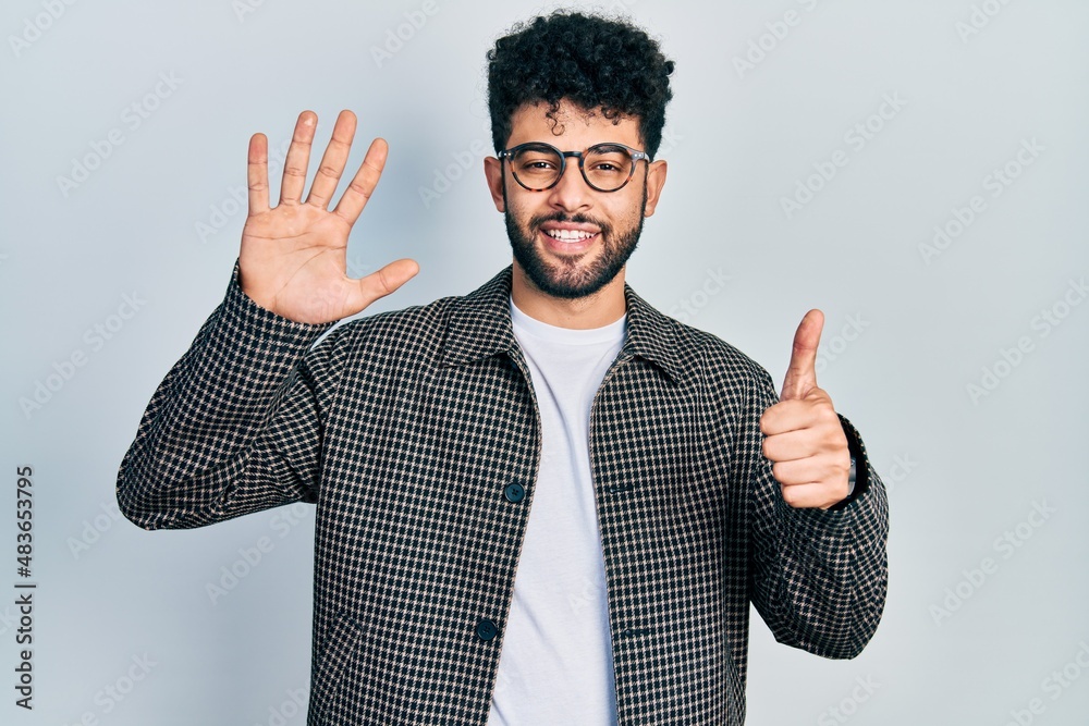 Young arab man with beard wearing glasses showing and pointing up with fingers number six while smiling confident and happy. Young arab man with beard wearing glasses showing and pointing up with fingers number six while smiling confident and happy.