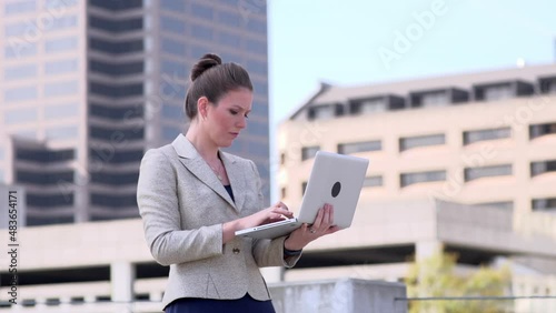 Businesswoman typing on laptop computer