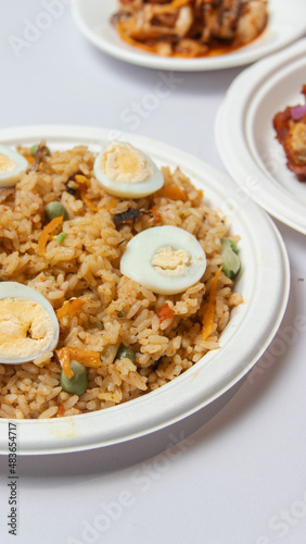 Nigeria Jollof rice with spicy chicken and side sauce