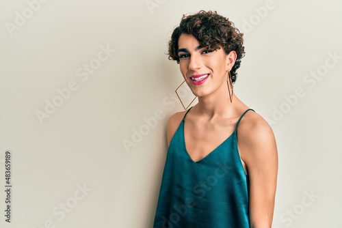 Young transgender man wearing make up and woman clothes, looking fashion and glamorous photo