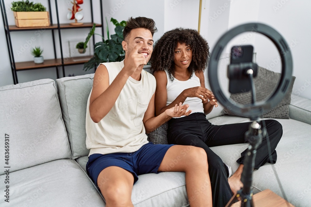 Man and woman couple using smartphone having video call at home Man and woman couple using smartphone having video call at home