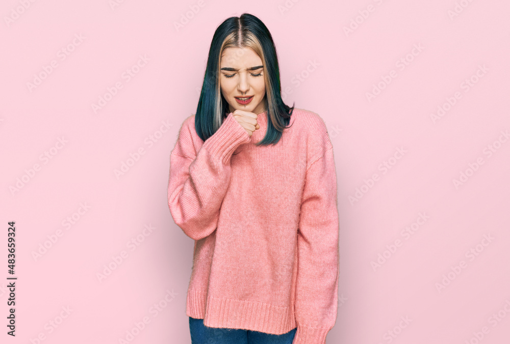 Young modern girl wearing pink wool winter sweater feeling unwell and coughing as symptom for cold or bronchitis. health care concept. Young modern girl wearing pink wool winter sweater feeling unwell and coughing as symptom for cold or bronchitis. health care concept.