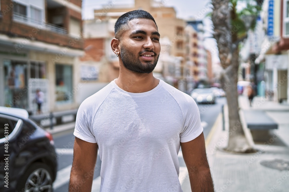 Young middle east man smiling happy standing at the city. Young middle east man smiling happy standing at the city.