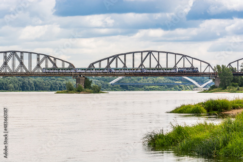 Torun, Poland - August 11, 2021. Ernest Malinowski Railway Bridge - Most kolejowy im. Ernesta Malinowskiego - in Summer © marketanovakova