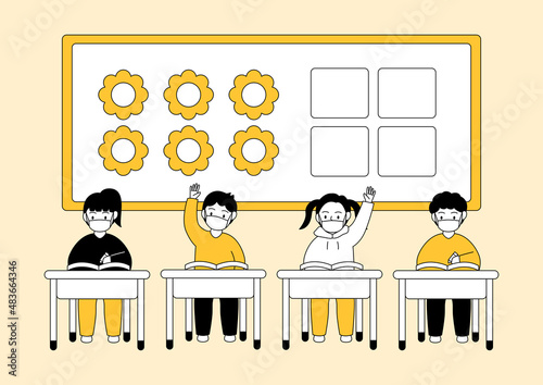 Children wearing masks and attending classes in the classroom.