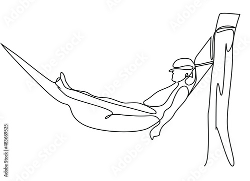 A man sleeping peacefully and comfortably in a hammock tied to a tree.