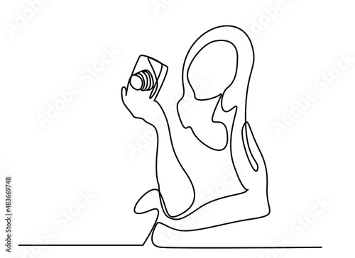 photographer waiting to record with camera in hand