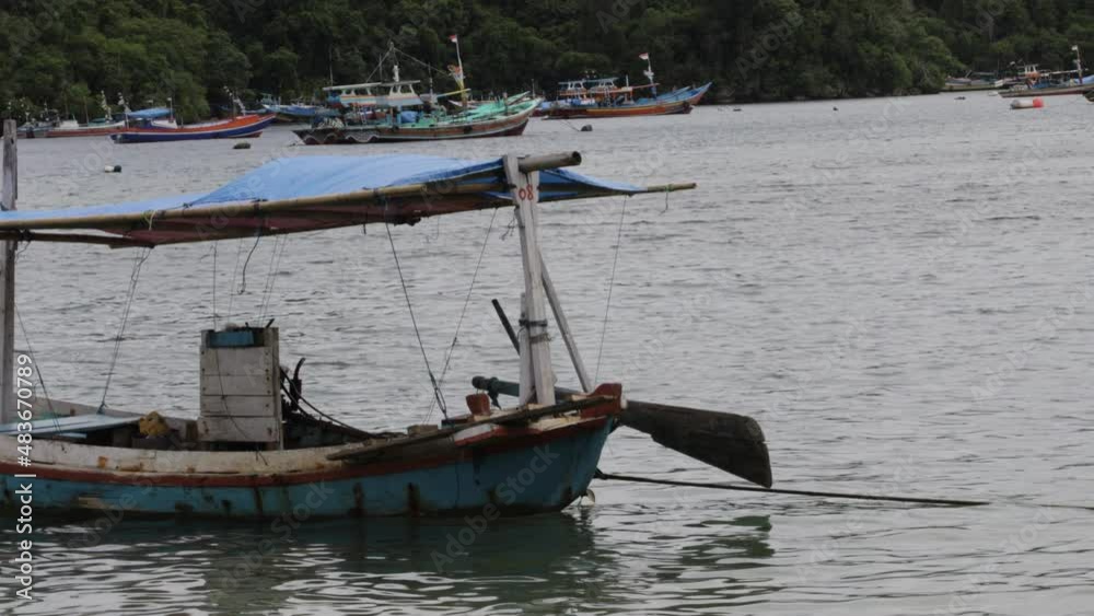 indonesia tourist boat on the sea coast of the tropical island of bali. Exotic Asian travel destination background indonesia tourist boat on the sea coast of the tropical island of bali. Exotic Asian travel destination background