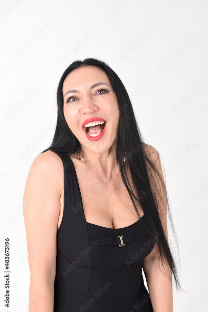 Portrait of a beautiful brunette woman with an explosive funny smile on a white background Portrait of a beautiful brunette woman with an explosive funny smile on a white background
