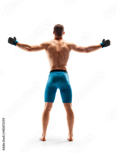 MMA fighter shows strength. Emotions of winner. Sport victory. Back view. Isolated on white background