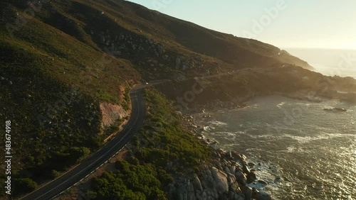 Aerial View Of Victoria Road Along Rocky Shoreline Of Oudekraal Beach In Cape Point, Cape Town, South Africa. photo