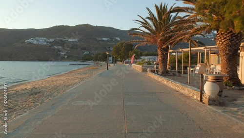 Beautiful promenade at sunset by the sea in the bay of the small typical village of Egliali on the island of Amorgos in Greece