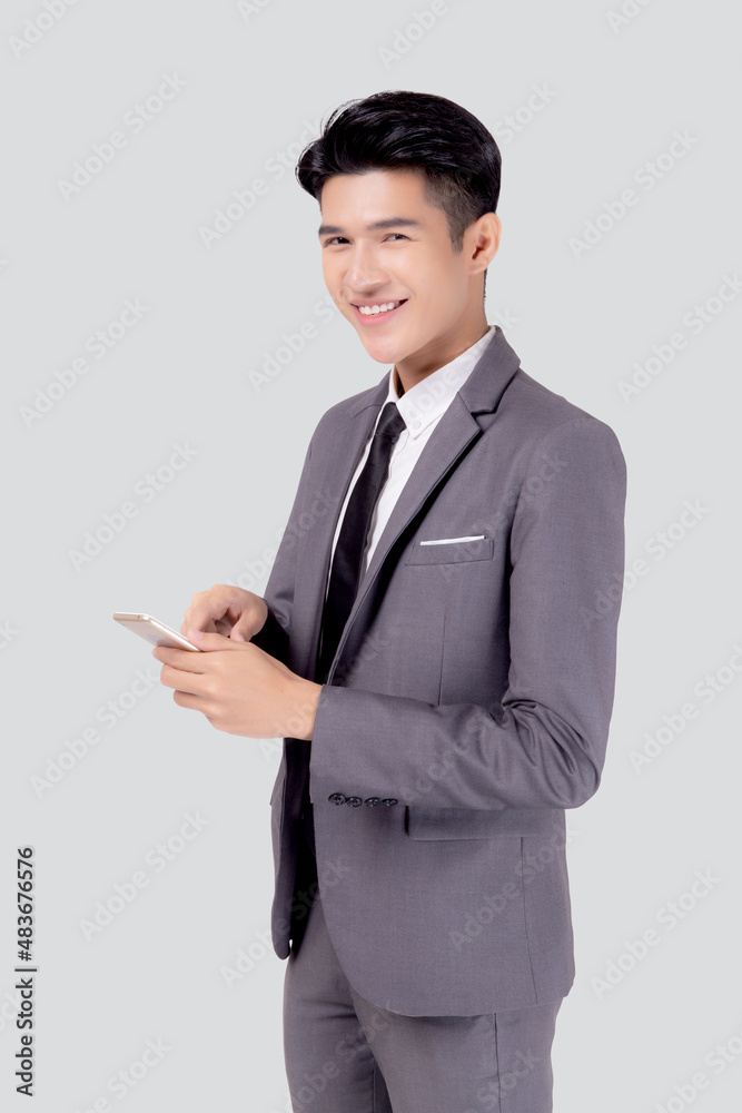 Portrait young asian business man in suit standing using smartphone to internet isolated on white background, businessman confident touch screen mobile phone with success, communication concept. Portrait young asian business man in suit standing using smartphone to internet isolated on white background, businessman confident touch screen mobile phone with success, communication concept.
