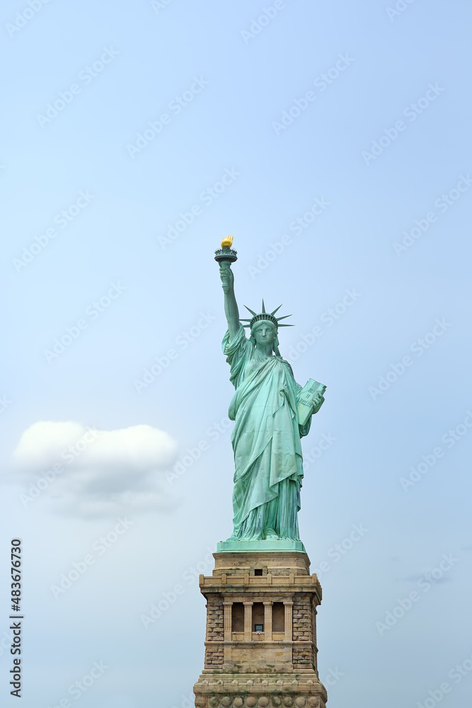 The statue of Liberty on the background of blue sky, New York City, USA The statue of Liberty on the background of blue sky, New York City, USA