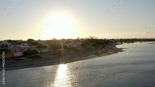Stunning Sunrise Over Ria Formosa In Algarve, Portugal With Reflections On Lagoon Water. aerial pullback