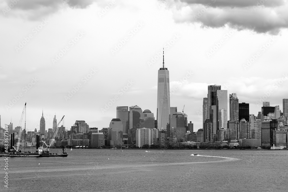 Black and white photo of famous New York City panorama with skyscrapers of Manhattan on the background. Travel, tourism, sightseeing of nyc, USA.
