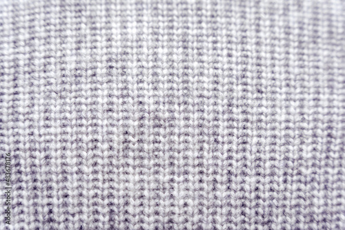 Gray knitted polyester and acrylic knit sweater fabric texture