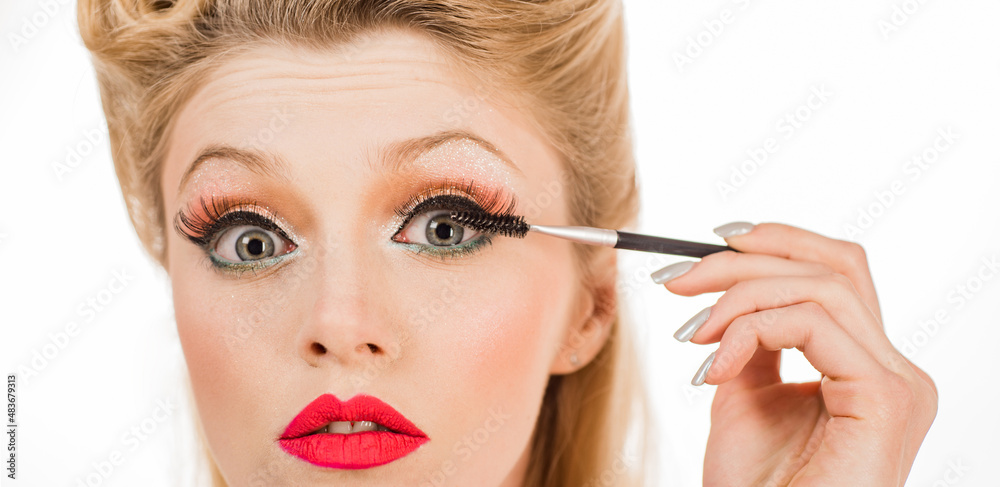 Womans eyebrows. Beautiful girl with eyebrow brush. Girl with natural make up. Eyebrow correction. Macro close up of brows.