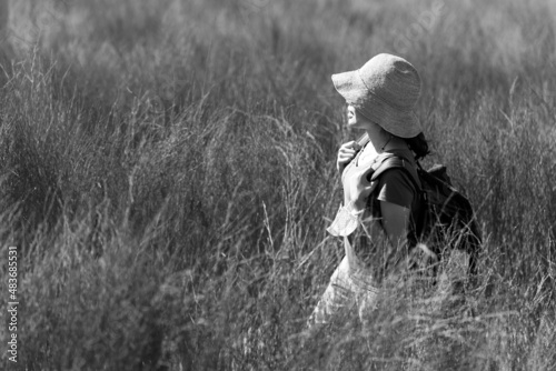 Portrait of Woman Walking in Meadow in Summer